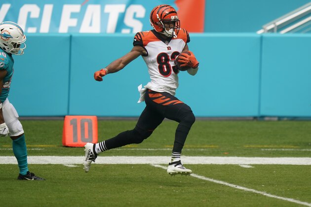 Cincinnati Bengals wide receiver Tyler Boyd (83) runs for a touchdown during the first half of an NFL football game against the Miami Dolphins, Sunday, Dec. 6, 2020, in Miami Gardens, Fla. (AP Photo/Wilfredo Lee)