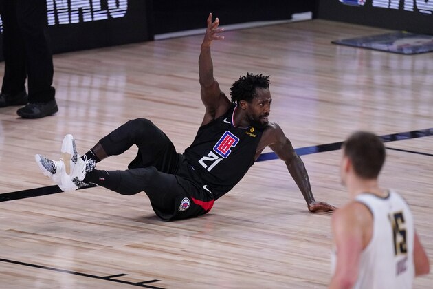 Los Angeles Clippers guard Patrick Beverley (21) argues a call during the first half of an NBA conference semifinal playoff basketball game against the Denver Nuggets, Tuesday, Sept. 15, 2020, in Lake Buena Vista, Fla. (AP Photo/Mark J. Terrill)