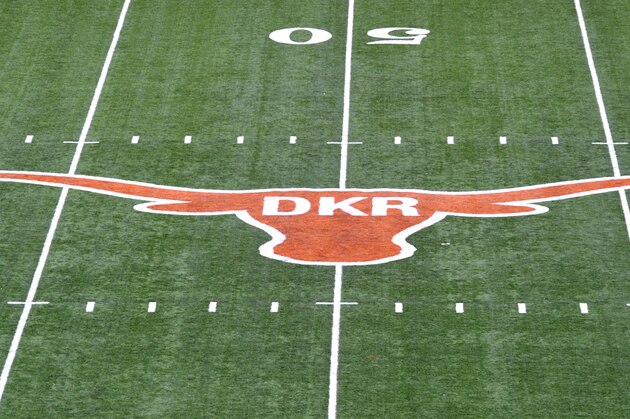 The initials of former Texas football coach Darrell K. Royal were painted inside the longhorn logo on the field at Darrell K. Royal-Memorial Stadium, Saturday, Nov. 10, 2012, in Austin, Texas. The initials were added in honor of Royal who passed away on Wednesday. (AP Photo/Michael Thomas)