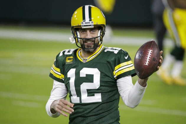 FILE - Green Bay Packers' Aaron Rodgers warms up before an NFL football game against the Chicago Bears in Green Bay, Wis., in this Sunday, Nov. 29, 2020, file photo. Rodgers is one of 32 players nominated for the seventh annual Art Rooney Sportsmanship Award, the NFL announced Thursday, Dec. 3, 2020. (AP Photo/Mike Roemer, File)