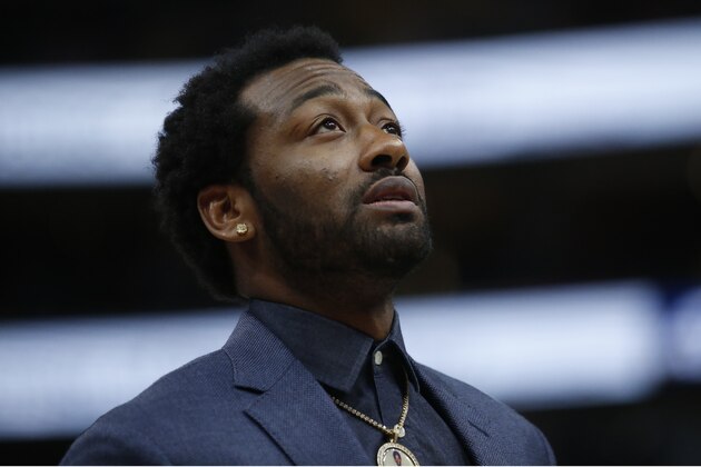 Washington Wizards John Wall looks on in the second half during an NBA basketball game against the Utah Jazz Friday, Feb. 28, 2020, in Salt Lake City. (AP Photo/Rick Bowmer)