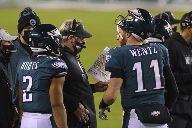 Philadelphia Eagles' Carson Wentz (11), Jalen Hurts (2) and head coach Doug Pederson during an NFL football game against the Seattle Seahawks, Monday, Nov. 30, 2020, in Philadelphia. The Seahawks defeated the Eagles (AP Photo/Rich Schultz) Philadelphia Eagles' Carson Wentz (11), Jalen Hurts (2) and head coach Doug Pederson during an NFL football game against the Seattle Seahawks, Monday, Nov. 30, 2020, in Philadelphia. The Seahawks defeated the Eagles (AP Photo/Rich Schultz)
