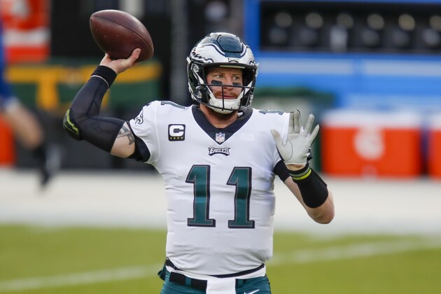 Philadelphia Eagles' Carson Wentz warms up before an NFL football game against the Green Bay Packers Sunday, Dec. 6, 2020, in Green Bay, Wis. (AP Photo/Matt Ludtke)