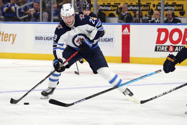 Winnipeg Jets winger Patrik Laine (29), of Sweden, controls the puck against the St. Louis Blues during the third period of an NHL hockey game Sunday, Dec. 29, 2019, in St. Louis. (AP Photo/Dilip Vishwanat)