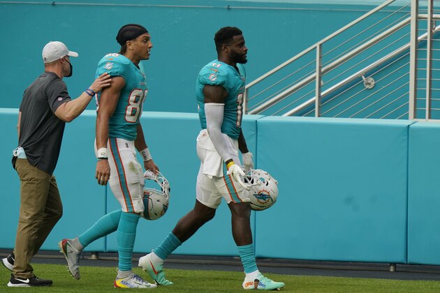 Miami Dolphins wide receiver Kirk Merritt (83) and wide receiver DeVante Parker (11) are lead off the field after they were disqualified following a fight during the second half of an NFL football game against the Cincinnati Bengals, Sunday, Dec. 6, 2020, in Miami Gardens, Fla. (AP Photo/Lynne Sladky) Miami Dolphins wide receiver Kirk Merritt (83) and wide receiver DeVante Parker (11) are lead off the field after they were disqualified following a fight during the second half of an NFL football game against the Cincinnati Bengals, Sunday, Dec. 6, 2020, in Miami Gardens, Fla. (AP Photo/Lynne Sladky)