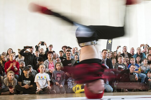 In this picture taken with a long time exposure Max Hesse  performs during the German Breakdance Championships in Magdeburg, Germany, Sunday, March 12, 2017. (AP Photo/Jens Meyer)