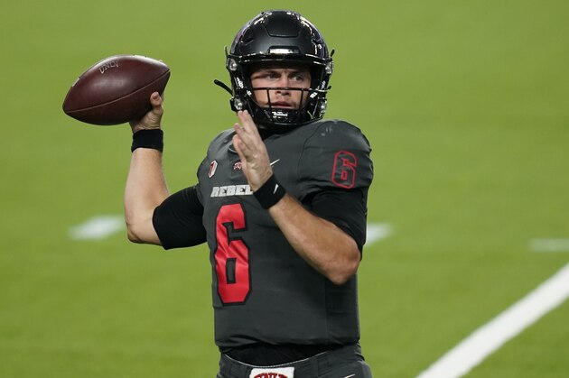 UNLV quarterback Max Gilliam (6) throws against Nevada during the second half of an NCAA college football game Saturday, Oct. 31, 2020, in Las Vegas. (AP Photo/John Locher)
