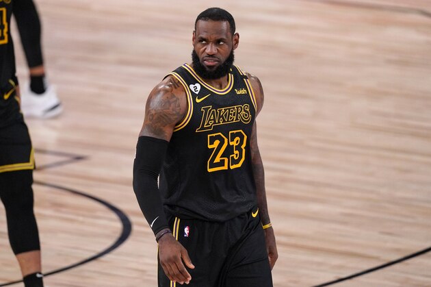 Los Angeles Lakers' LeBron James walks up court during the first half of Game 2 of basketball's NBA Finals against the Miami Heat on Friday, Oct. 2, 2020, in Lake Buena Vista, Fla. (AP Photo/Mark J. Terrill)