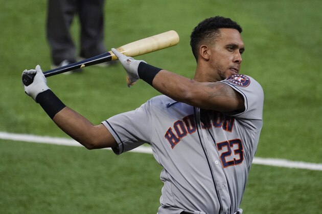 Houston Astros designated hitter Michael Brantley takes a practice swing before the team's baseball game against the Texas Rangers in Arlington, Texas, Thursday, Sept. 24, 2020. (AP Photo/Tony Gutierrez)