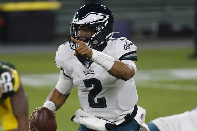 Philadelphia Eagles quarterback Jalen Hurts (2) looks to run the ball during an NFL football game, Sunday, Dec 6. 2020, between the Philadelphia Eagles and Green Bay Packers in Green Bay, Wis. (AP Photo/Jeffrey Phelps)