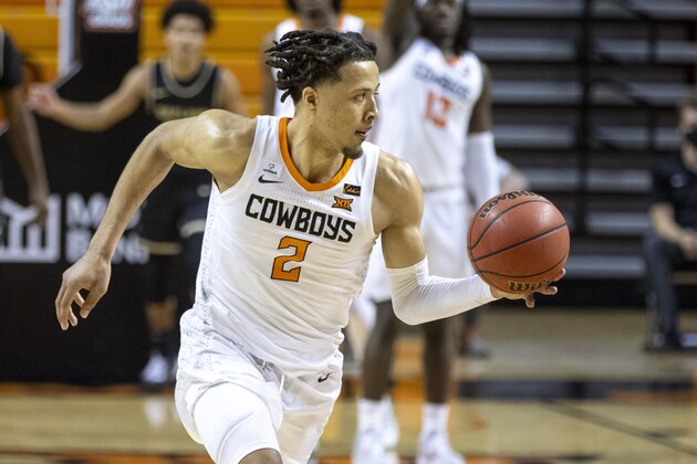 Oklahoma State's Cade Cunningham brings the ball up the court during the second half of the NCAA college basketball game against Oakland in Stillwater, Okla., Saturday, Dec. 5, 2020. (AP Photo/Mitch Alcala)
