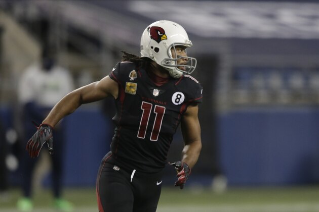 Arizona Cardinals' Larry Fitzgerald runs on the field against the Seattle Seahawks during the second half of an NFL football game, Thursday, Nov. 19, 2020, in Seattle. (AP Photo/Lindsey Wasson)