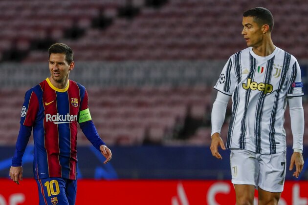 Barcelona's Lionel Messi, left, and Juventus' Cristiano Ronaldo during the Champions League group G soccer match between FC Barcelona and Juventus at the Camp Nou stadium in Barcelona, Spain, Tuesday, Dec. 8, 2020. (AP Photo/Joan Monfort) Barcelona's Lionel Messi, left, and Juventus' Cristiano Ronaldo during the Champions League group G soccer match between FC Barcelona and Juventus at the Camp Nou stadium in Barcelona, Spain, Tuesday, Dec. 8, 2020. (AP Photo/Joan Monfort)