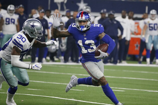 New York Giants wide receiver Odell Beckham (13) runs past Dallas Cowboys cornerback Anthony Brown (30) during the second half of an NFL football game in Arlington, Texas, Sunday, Sept. 16, 2018. (AP Photo/Michael Ainsworth)