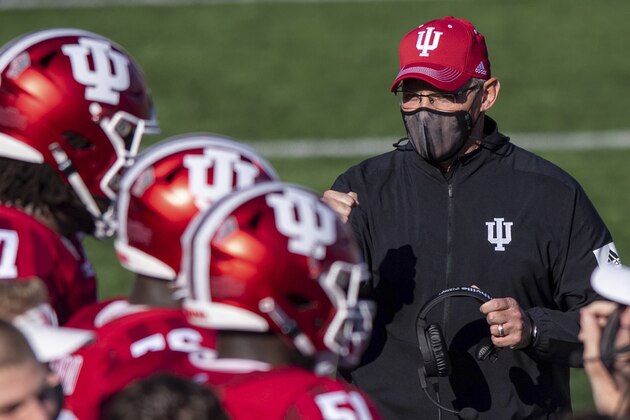 FILE - In this Saturday, Nov. 7, 2020, file photo, Indiana head coach Tom Allen looks towards his players on the sideline during a break in the second half of an NCAA college football game against Michigan in Bloomington, Ind. In an era when the College Football Playoff increasingly features the nation’s highest-scoring teams, this year’s Big Ten race shows defense still matters. (AP Photo/Doug McSchooler, File)