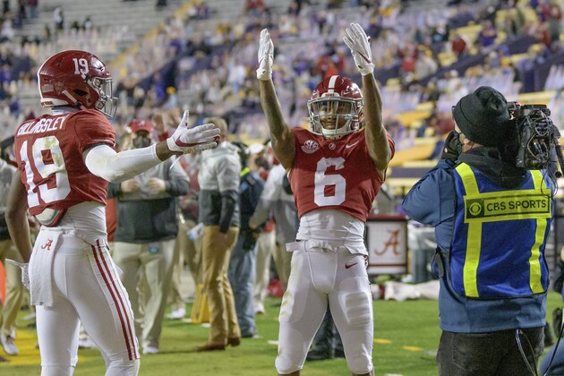 Alabama wide receiver DeVonta Smith (6) blows kisses to the stands after a touchdown during the first half of an NCAA college football game against LSU in Baton Rouge, La., Saturday, Dec. 5, 2020. (AP Photo/Matthew Hinton)