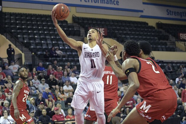 File-This Nov. 29, 2019, file photo shows Harvard guard Bryce Aiken (11) going up for a shot in front of Maryland forward Donta Scott (24), guard Darryl Morsell (11), guard Eric Ayala and guard Aaron Wiggins (2) during the first half of an NCAA college basketball game in Lake Buena Vista, Fla. Although the Ivy League wonâ€™t have a basketball season this year, a few of its most notable recent performers will be playing for new schools in different conferences. Former Harvard stars  Aiken and Seth Towns, as well as ex-Yale standout Jordan Bruner, left as graduate transfers during the offseason. Aiken headed to Seton Hall, Towns joined No. 23 Ohio State, and Bruner opted to finish his career in Alabama. (AP Photo/Phelan M. Ebenhack, File)