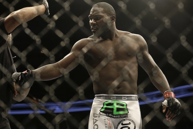 Anthony Johnson is pushed away by referee Herb Dean after beating Antonio Rogerio Nogueira by technical knockout during a light heavyweight mixed martial arts bout at a UFC on Fox event in San Jose, Calif., Saturday, July 26, 2014. Johnson won by technical knockout. (AP Photo/Jeff Chiu)