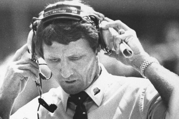 Alabama head coach Ray Perkins removes his headset near the end of the opening day game against Georgia Tech in Birmingham, Ala., Sept. 10, 1983. Perkins, in his first year as head coach at Alabama, replaced the late Paul