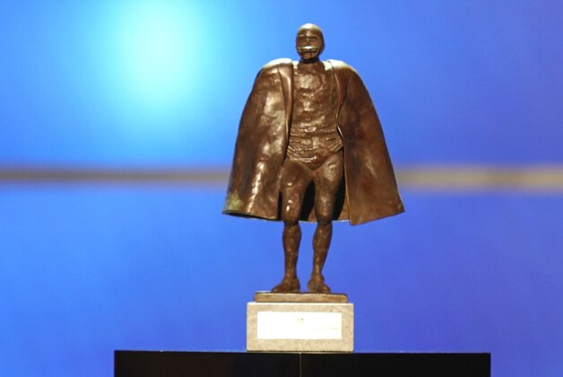 FILE - In this Feb. 2, 2019, file photo, former NFL player Peyton Manning presents the Walter Payton NFL man of the year award at the 8th Annual NFL Honors at The Fox Theatre in Atlanta. Just as he had the true touch when he threw passes, set records and won two Super Bowls on the field, Peyton Manning possesses the right approach to look back at some of the NFL’s greatest moments. Manning, a lock for the Pro Football Hall of Fame when he becomes eligible in 2021, is hosting and serves as one of the executive producers for “Peyton’s Places,” a five-part, 30-episode series that celebrates the NFL’s 100th season. (Photo by Paul Abell/Invision for NFL/AP Images, File)