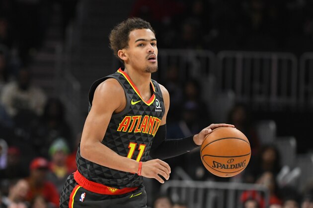 Atlanta Hawks guard Trae Young (11) dribbles upcourt during an NBA basketball game against the Charlotte Hornets, Monday, March 9, 2020, in Atlanta. (AP Photo/John Amis)