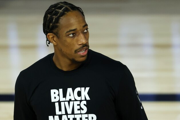 San Antonio Spurs' DeMar DeRozan warms up prior to the start of an NBA basketball game against the Utah Jazz  Friday, Aug. 7, 2020, in Lake Buena Vista, Fla. (Kevin C. Cox/Pool Photo via AP)