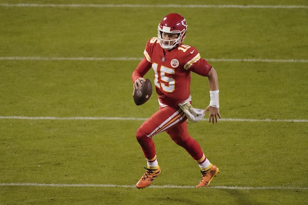 Kansas City Chiefs quarterback Patrick Mahomes runs the ball against the Denver Broncos in the second half of an NFL football game in Kansas City, Mo., Sunday, Dec. 6, 2020. (AP Photo/Charlie Riedel )