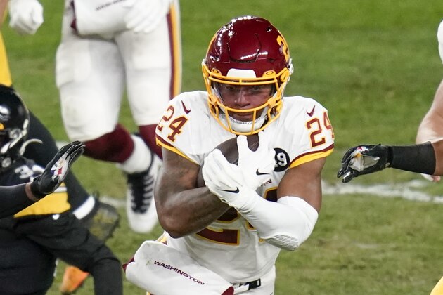 Washington Football Team running back Antonio Gibson (24) runs the ball past Pittsburgh Steelers strong safety Terrell Edmunds (34)during an NFL football game, Monday, Dec. 7, 2020, in Pittsburgh. (AP Photo/Keith Srakocic)