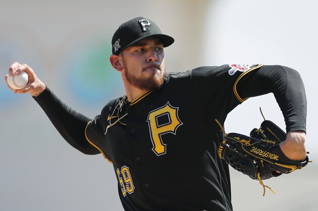 FILE - Pittsburgh Pirates starting pitcher Joe Musgrove plays during a spring training baseball game, Thursday, March 12, 2020, in Bradenton, Fla. Musgrove doesn't like wearing a mask more than any of his Pittsburgh Pirate teammates. Yet the pitcher wore one anyway  during the first day of workouts on Friday, just one way he is trying to lead  a pitching staff searching for an ace with Jameson Taillon and Chris Archer already out for 2020. (AP Photo/Carlos Osorio)