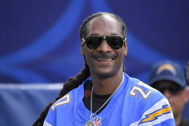 Rapper, Snoop Dogg watches during warm ups before an NFL football game between the Los Angeles Chargers and the Houston Texans Sunday, Sept. 22, 2019, in Carson, Calif. (AP Photo/Mark J. Terrill)