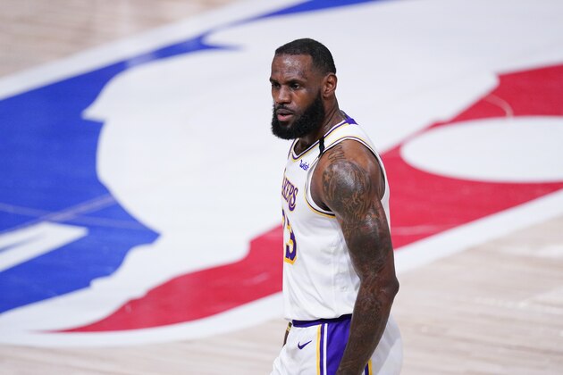 Los Angeles Lakers' LeBron James walks back after making a 3-point shot during the first half of an NBA conference semifinal playoff basketball game against the Houston Rockets Saturday, Sept. 12, 2020, in Lake Buena Vista, Fla. (AP Photo/Mark J. Terrill)