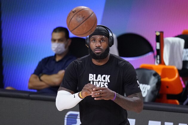 Los Angeles Lakers' LeBron James warms up before an NBA conference semifinal playoff game against the Houston Rockets game Saturday, Sept. 12, 2020, in Lake Buena Vista, Fla. (AP Photo/Mark J. Terrill)