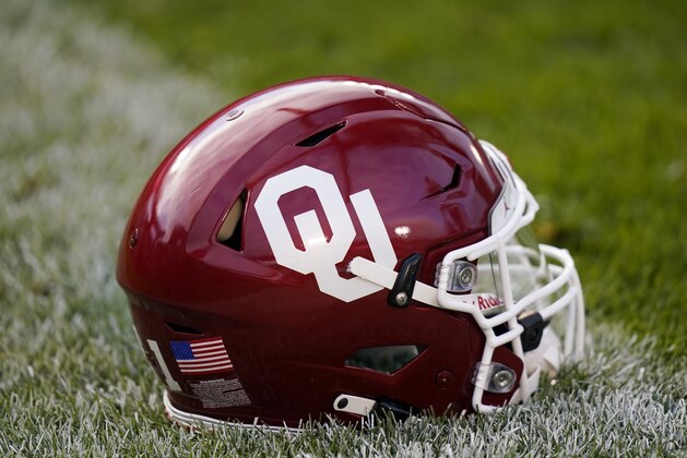 An Oklahoma helmet sits on the field before an NCAA college football game between Iowa State and Oklahoma, Saturday, Oct. 3, 2020, in Ames, Iowa. (AP Photo/Charlie Neibergall)