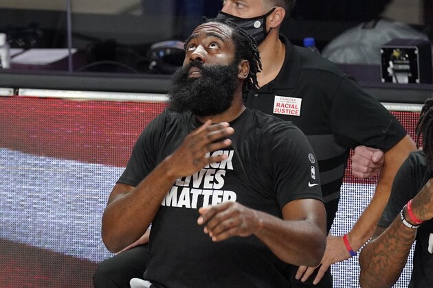 Houston Rockets' James Harden knees before the first half of an NBA conference semifinal playoff basketball game against the Los Angeles Lakers Sunday, Sept. 6, 2020, in Lake Buena Vista, Fla. (AP Photo/Mark J. Terrill)