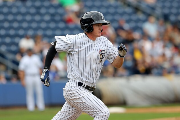 Staten Island Yankees Kyle Holder #14 in action against the State College Spikes during a minor league baseball game in Staten Island, NY on Sunday, June 28, 2015.  (AP Photo/Gregory Payan)