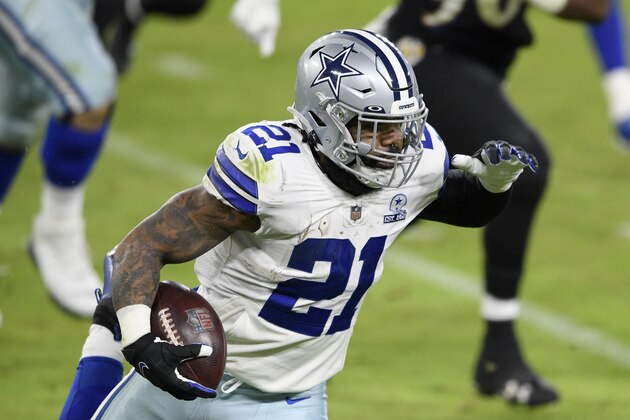 Dallas Cowboys running back Ezekiel Elliott (21) runs with the ball during the first half of an NFL football game against the Baltimore Ravens, Tuesday, Dec. 8, 2020, in Baltimore. (AP Photo/Nick Wass)