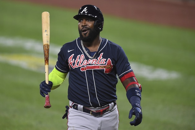 Atlanta Braves designated hitter Marcell Ozuna (20) reacts to strike out during the sixth inning of a baseball game against the Baltimore Orioles, Tuesday, Sept. 15, 2020, in Baltimore. (AP Photo/Terrance Williams)