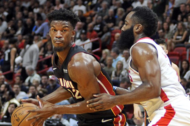 Miami Heat guard Jimmy Butler, left, drives against Houston Rockets guard James Harden during the first half of an NBA basketball game, Sunday, Nov. 3, 2019, in Miami. (AP Photo/Gaston De Cardenas)