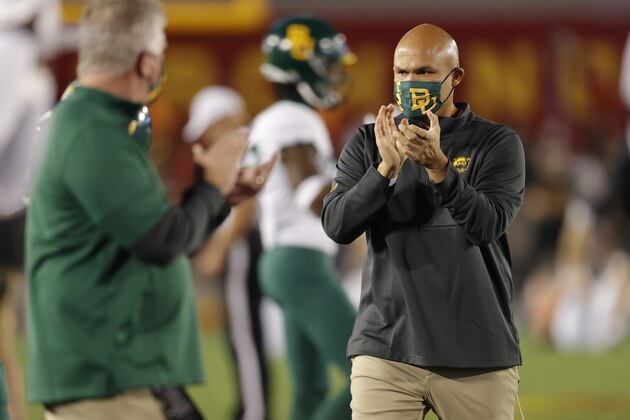 Baylor coach Dave Aranda applauds as players warm up for the team's NCAA college football game against Iowa State, Saturday, Nov. 7, 2020, in Ames, Iowa. (AP Photo/Matthew Putney)