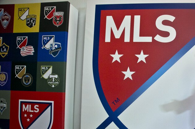 FILE - In this Sept. 18, 2014, file photo, Major League Soccer Commissioner Don Garber launches the league's new logo during a press conference  in New York. Garber said Tuesday, Dec 2, 2014, the league is not performing as hoped financially with the league and its franchises still losing more than $100 million combined annually.   (AP Photo/Bebeto Matthews)