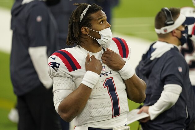 New England Patriots quarterback Cam Newton watches from the sideline after being pulled from the game during the second half of an NFL football game against the Los Angeles Rams Thursday, Dec. 10, 2020, in Inglewood, Calif. (AP Photo/Ashley Landis)