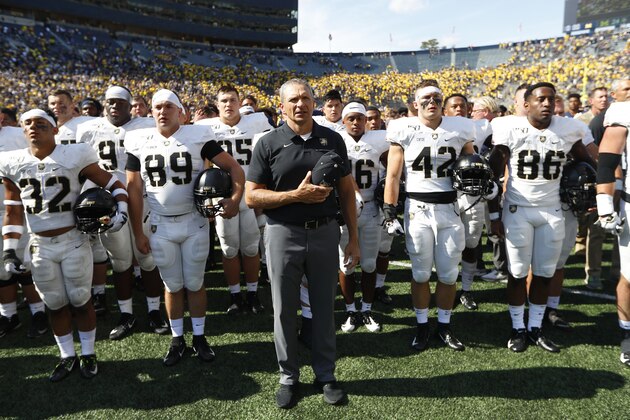 Army head coach Jeff Monken stands with his team singing after an NCAA college football game against Michigan in Ann Arbor, Mich., Saturday, Sept. 7, 2019. Michigan won 24-21 in double-overtime. (AP Photo/Paul Sancya)