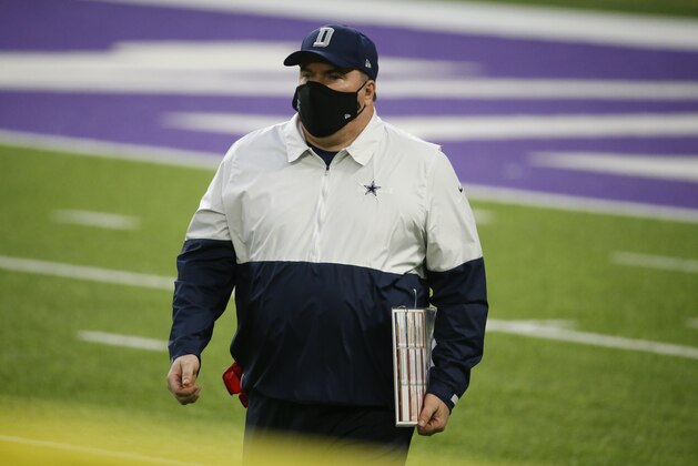 Dallas Cowboys head coach Mike McCarthy walks on the field during the first half of an NFL football game against the Minnesota Vikings, Sunday, Nov. 22, 2020, in Minneapolis. (AP Photo/Bruce Kluckhohn)