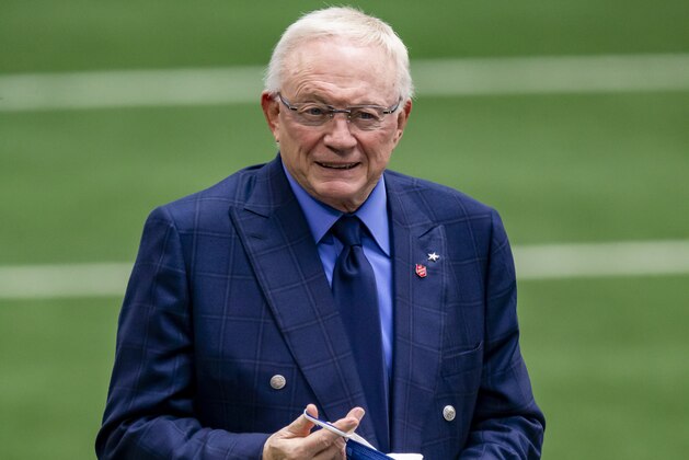 Dallas Cowboys owner Jerry Jones puts on a mask before an NFL football game against the Pittsburgh Steelers, Sunday, Nov. 8, 2020, in Arlington, Texas. Pittsburgh won 24-19. (AP Photo/Brandon Wade)