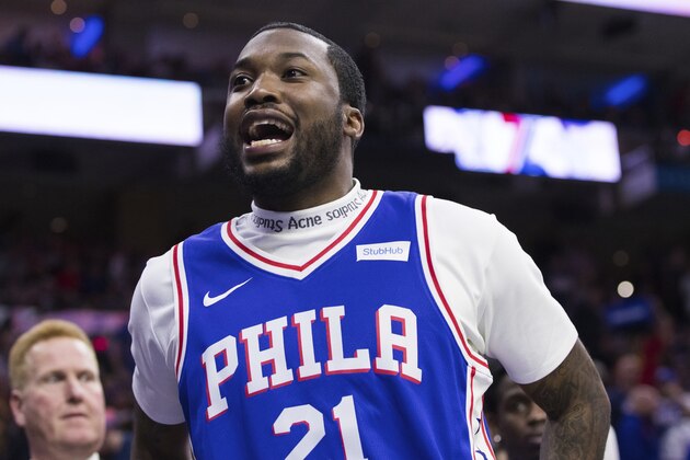 Rapper Meek Mill reacts during the first half in Game 5 of a first-round NBA basketball playoff series between the Miami Heat and the Philadelphia 76ers, Tuesday, April 24, 2018, in Philadelphia. The 76ers won 104-91. (AP Photo/Chris Szagola)