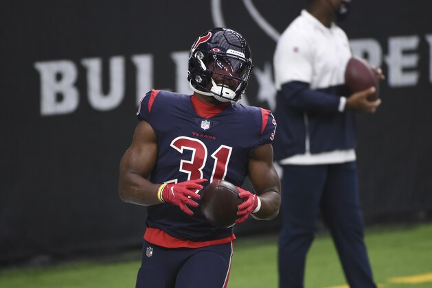 Houston Texans running back David Johnson warms up before the start of an NFL football game against the Green Bay Packers Sunday, Oct. 25, 2020, in Houston. (AP Photo/Eric Christian Smith)