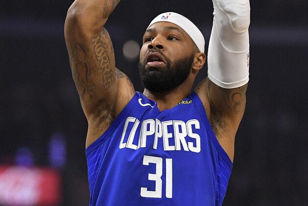 Los Angeles Clippers forward Marcus Morris Sr. shoots during the first half of an NBA basketball game against the Philadelphia 76ers Sunday, March 1, 2020, in Los Angeles. (AP Photo/Mark J. Terrill) Los Angeles Clippers forward Marcus Morris Sr. shoots during the first half of an NBA basketball game against the Philadelphia 76ers Sunday, March 1, 2020, in Los Angeles. (AP Photo/Mark J. Terrill)