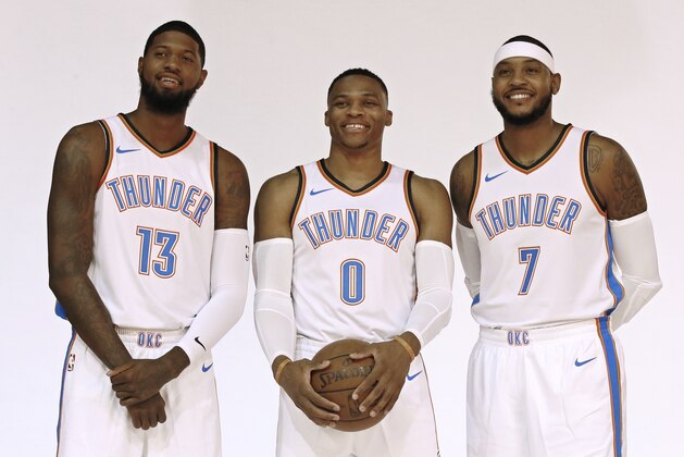 Oklahoma City Thunder's Paul George (13), Russell Westbrook (0) and Carmelo Anthony (7) pose for a photo during an NBA basketball media day in Oklahoma City, Monday, Sept. 25, 2017. (AP Photo/Sue Ogrocki)