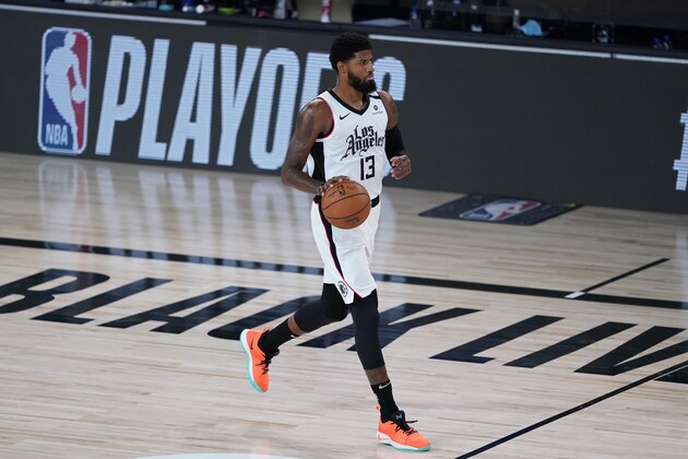 Los Angeles Clippers' Paul George (13) dribbles the ball down court against the Dallas Mavericks during the first half of an NBA basketball first round playoff game Tuesday, Aug. 25, 2020, in Lake Buena Vista, Fla. (AP Photo/Ashley Landis, Pool)