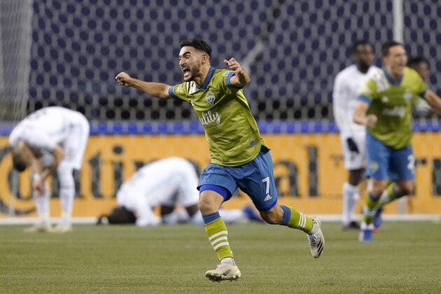 Seattle Sounders' Cristian Roldan (7) celebrates a Sounders goal late in the second half of an MLS playoff Western Conference final soccer match against Minnesota United, Monday, Dec. 7, 2020, in Seattle. The Sounders won 3-2. (AP Photo/Ted S. Warren)